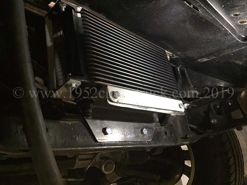 Transmission cooler in the air flow
